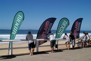 Teardrop and sail banners at the beach